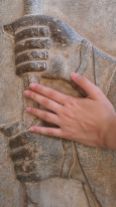A bas-relief from centuries ago and a hand of today…