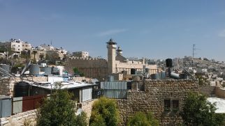 While searching the main entrance to the Jewish compound/settlement/neighborhood, we stumbled upon the Hebron Rehabilitation Committee. I entered and met Mr. Rafi. He let us up on the roof. We finally had a glance at the mosque. According to tradition that has been associated with the Holy Books Torah, Bible and Quran, the cave and adjoining field were purchased by Abraham as a burial plot. Dating back over 2,000 years, the monumental Herodian compound is believed to be the oldest continuously used intact prayer structure in the world, and is the oldest major building in the world that still fulfills its original function